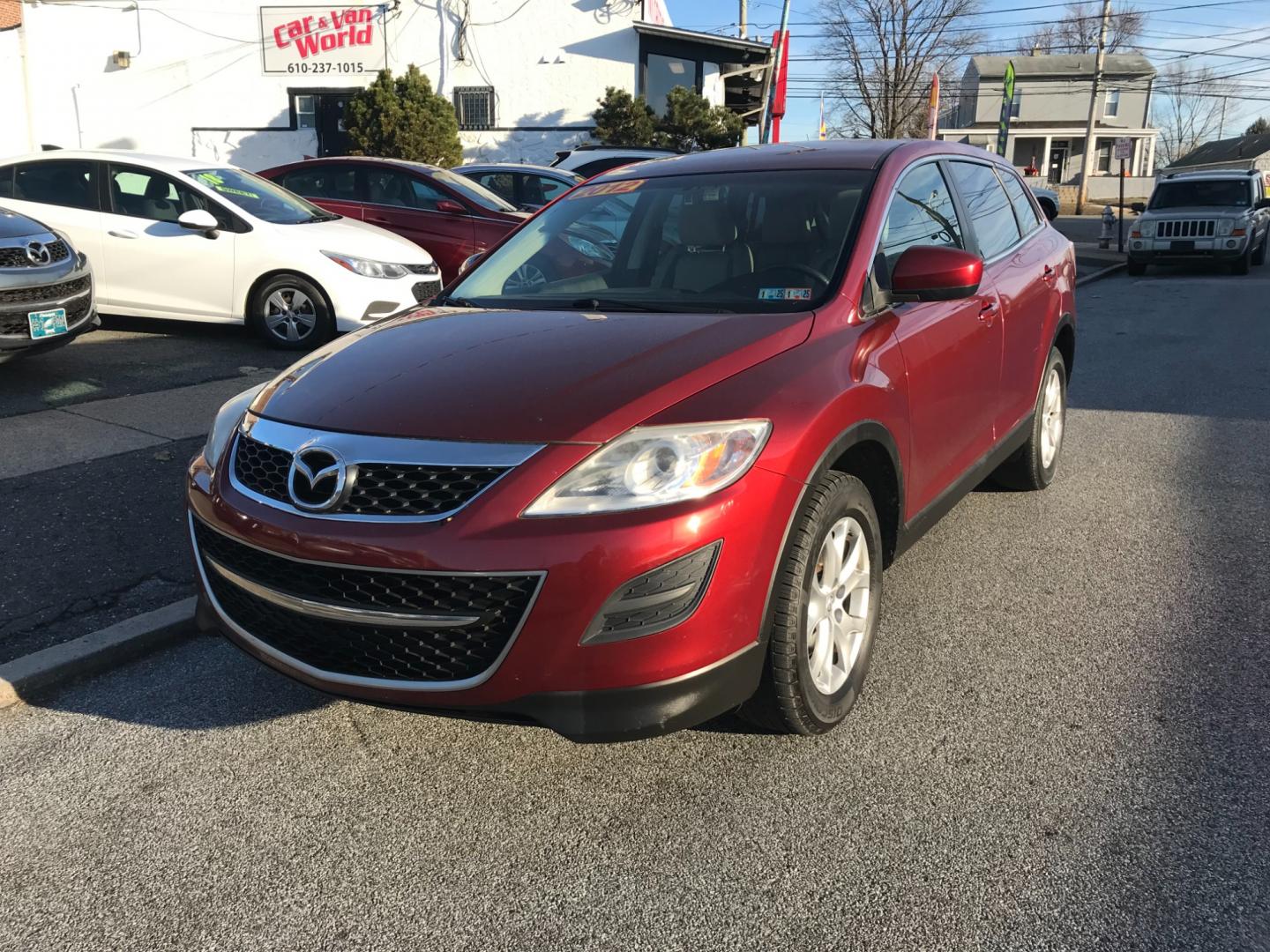 2012 Red /Tan Mazda CX-9 Touring (JM3TB3CV5C0) with an 3.7 V6 engine, Automatic transmission, located at 577 Chester Pike, Prospect Park, PA, 19076, (610) 237-1015, 39.886154, -75.302338 - Photo#2